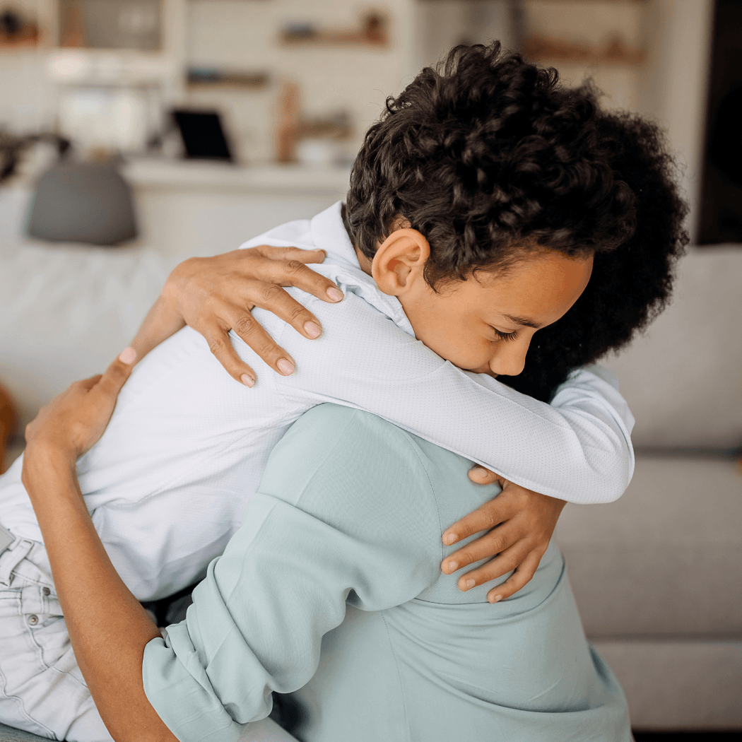 A mother and son hugging